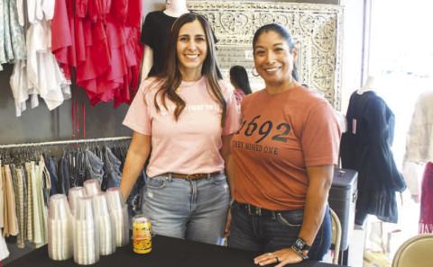 Amanda and Roxann served Sip and Swirl attendees beer inside K’s Glamour Corner in downtown Levelland on Friday night. (Staff photo by Evin Thomas)