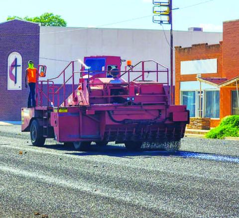 HOUSTON STREET - Hockley County Texas Department of Transportation crews worked on seal coating Houston Street throughout the week. Crews began the project by working on West Avenue leading up to Highway 114 before following down Houston Street to College Avenue. TxDOT crews have been working through various parts of Hockley County seal coating roads through the month of July into August. (Staff photo by Dom Puente)