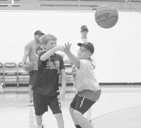 GOOD PASS - Whitharral students Westin Thompson and Caden Bates were working on their passes during the Whitharral All-Sports Camp. (Staff Photo by Aalijah Soliz)