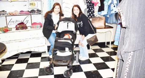 SHOPPING WITH BABY - Pictured are Ashton White, Allie Loewrigkeit and baby at Studio K on Saturday. Studio K participated in the Rise, Shine and Shop event on the Levelland Square where customers could eat brunch while browsing various shops. (Staff photo by Ada Niederhauser)