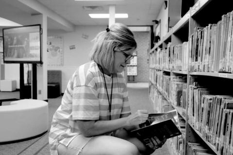 BOOK MATCHMAKER - Capitol Elementary School librarian, Pam Alexander was seen setting out books and making the library a nice and cozy place for children to relax and read. (Staff photo by Hannah Woodrum)