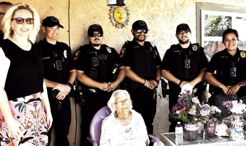 Happy 100th Birthday - Marking another City of Levelland Centennial year moment, Levelland Police Department officers and Mayor Breann Buxkemper joined Margarita Estrada in celebrating her own Centennial birthday. Estrada was presented with a plaque, flowers and gifts in honor of her life and contributions to the community, her family and friends. (Staff Photo by C. R Calhoun)