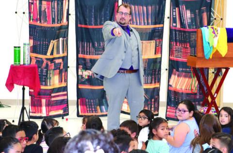 MAGIC AND READING- The Hockley County Library Summer Program kicked off on Wednesday with Magic by Bronson. He taught the children about the importance of reading by using magic tricks. Pictured is Bronson Chadwick.(Staff photo by Emily Campos)
