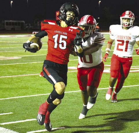 PUSHED OUT- Levelland Lobo Wyatt Baccus sprinted up the sideline before being pushed out of bounds by a Perryton defender. The Perryton Rangers handed the Lobos a 28-10 loss in their district opener at Lobo Stadium last Friday. (Staff Photo by Dom Puente)