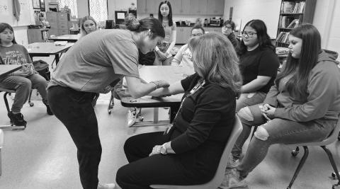 CTE CLASS- The LHS Patient Care Technician Course, taught by Mrs. Joan Sanders gives students an opportunity for a career after high school and is a great CTE class. Mrs. Sanders teaches Patient Care students what they need to become certified to become a Patient Care Technician. This month they are studying phlebotomy and are actually working on real people after much practice on dummies. (Photo from LISD)
