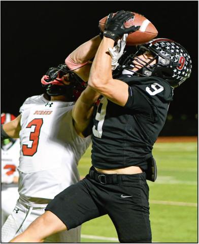 CONTESTED CATCH - Levelland senior running back Matthew Gullien goes up for the contested catch over a Borger defender during a football game this past Friday night at Lobo Stadium. (Staff photo by Jentezen Smith)