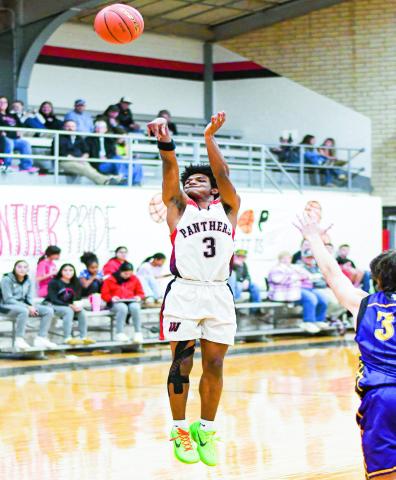 THREE-POINT THREAT - Whitharral Panther Brent Robinson shoots a three-pointer during their district game against Anton at Whitharral High School this past Thursday. Robinson would make three three’s in the win. (Staff photo by Jentezen Smith)