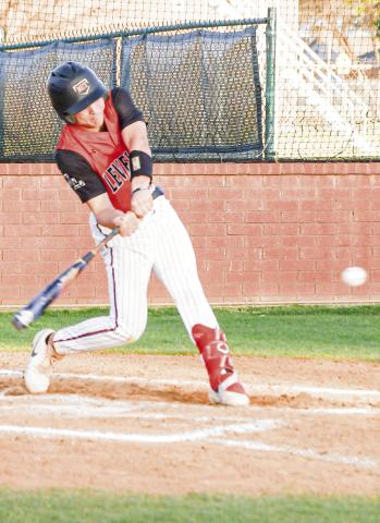 POWER SWING - Levelland Lobo Jake Potter swings hard at a pitch during their district baseball game against Big Spring this past Tuesday night at the Lobo Diamond. (Staff photo by Jentezen Smith)