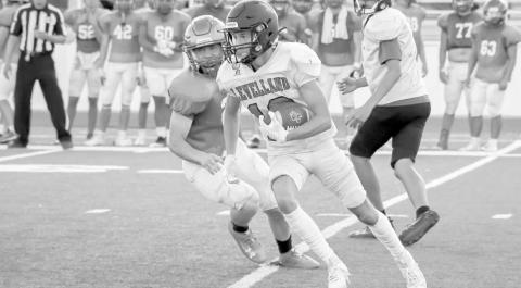 UPFIELD - Levelland running back Kysen Niblett ran the ball during Levelland’s scrimmage against Idalou last Friday to solitify the run game that the Lobo offense is trying to instill. The Levelland Lobos will have one more scrimmage against Big Springs before their season starts. (Staff photo by Dom Puente)