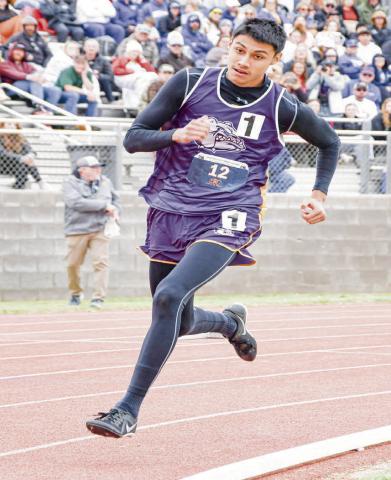 LEAN INTO THE CURVE - Anton Bulldog Xavi Avalos leans into the curve as he sprints during the 200-meter dash this past Friday at the Regional Championships at South Plains College. (Staff photo by Jentezen Smith)