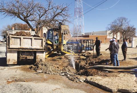 WATER LINE REPAIR - The Cityof Levelland Water Department were busy Friday morning as they worked to uncover a busted water line on Avenue J between Houston and Austin Street. The crew addressing the line worked through the day to make the necessary repairs. (Staff photo by Dom Puente)
