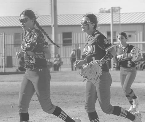 LOCKDOWN DEFENSE - Levelland Loboettes Saydi Mendez and Jazlyn Diaz jogged off the field after Diaz secured a pop fly in right field to get their defense off the field against the Sweetwater Lady Mustangs this past Tuesday. The Loboettes improve to 1-0 in distict play after their convincing win against the Lady Mustangs. The Loboettes improve to 10-11 on the season. (Staff photo by Aalijah Soliz)