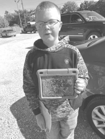 KLBGOLDENPICKERAWARD - Kade Gregory, Hockley County 4H member found the most unusual item at the Community Wide Cleanup on October 7. Gregory found a broken tablet and a hamster wheel. Gregory won the Golden Picker Award, McDonald’s gift card, Keep Levelland Beautiful t-shirt and Don’t Mess with Texas Reusable bag. Josh Meredith Keep Levelland Beautiful Advisory Chair said, “The Most Unusual Item Contest is always a fun part of Community Cleanup event.” (Photo submitted by Chamber of Commerce)