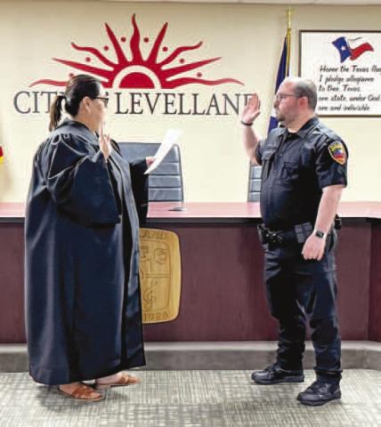 ADDINGA NEW OFFICER - New members of the Levelland Police Department were sworn-in Wednesday morning at City Hall. Pictured is Cory Painter being sworn-in as a the newest officer for the LPD. (Photo courtesy of LPD)