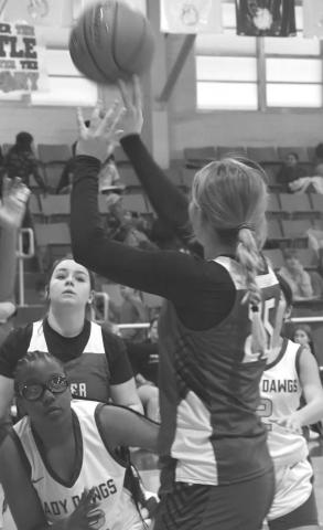 DEEP - Smyer’s Maegan Smith made a basket in a 61-22 win over the host Anton Lady Bulldogs during the Anton Classic High School Basketball Tournament last weekend. The Smyer girls took second, falling to Ropes 58-24 in the final. Smith was named to the all-tournament team. (Staff photo by Jay Kelley)