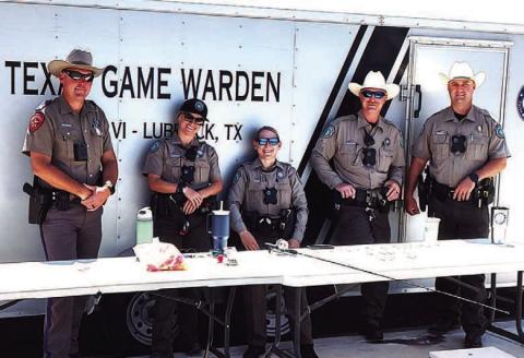 FISHING EVENT – Pictured are game wardens who came to Casting with Cops on Saturday. The event was a fun way to get to know local law enforcement while fishing at Lobo Lake. (Staff photo)