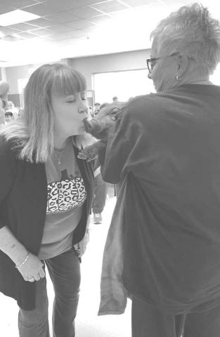 KISS A PIG - LMS students raised money to make an administrator Kiss A Pig! They raised $700 that will go right back to them. The lucky pig kisser was LMS Assistant Principal Laurie Jones. (Photo by Levelland ISD)
