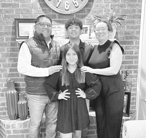NEW COACH- Nathan Flores took the new assistant coach job at Ropes. Flores will be coaching basketball, football, and mainly baseball. Pictured above is Nathan Flores, Leandra Flores, Elijah Flores, and Emmie Flores. (Submitted Photo)