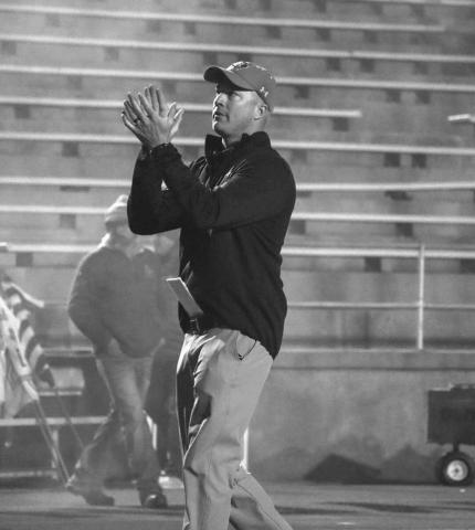 CLAP IT UP - Ropes Head Football Coach Beau Riker warmed up his team during their last game against Gruver in Canyon. (Staff photo by Aalijah Soliz)