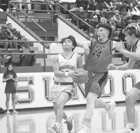 DOWNHILL - Sundown Roughneck Jay Martinez brought the ball down court during the teams contest against the New Home Leopards this past week at home. The Roughnecks will face off against the Tahoka Bulldogs this Friday at home. (Staff photo by Aalijah Soliz)