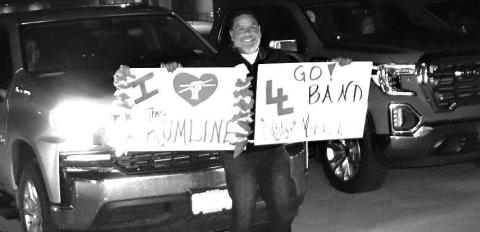 SHOWINGSUPPORT-- Jacob Velardez showed up early Saturday morning for the Levelland High School Lobo Band sendo-off to Abilene for UIL Marching Contest. He was among several families who come out to show support of the Lobo band. Jacob is the father of Olivia Velardez, who plays in the Lobo drumline. (Staff Photo by Shawn Franklin)