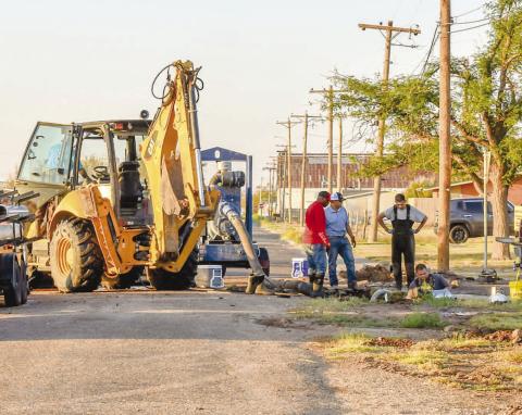 WATER LINE REPAIR - The public works department for the City of Levelland had a crew respond to a water leak Wednesday night after a fire hydrant was hit and caused damaged to the line on the corner of Rose Avenue and West Adams Street near Carver. The crew worked on repairing the line throughout the night before wrapping up repairs Thursday morning. (Photo courtesy of Emily Campos)