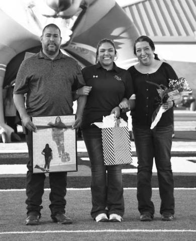 SENIOR TRAINER- Levelland seniors were recognized last Friday during the Lobos home game against Borger. Trainer Cecilia Berumen was escorted by her parents Manuel and Laura Berumen. (Staff Photo by Dom Puente)