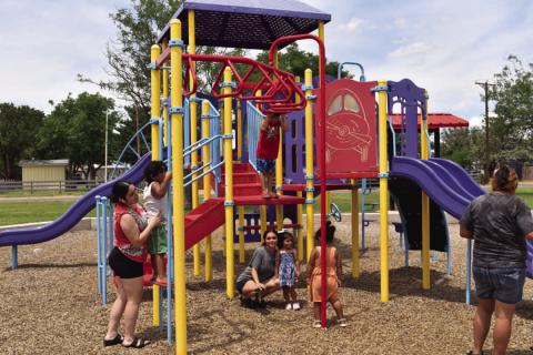 LET’S PLAY - Residents are pictured playing at Bartlett Park this past week. After the much-needed rain, temperatures were just right for residents to enjoy local parks. (Staff photo by C.R. Calhoun)