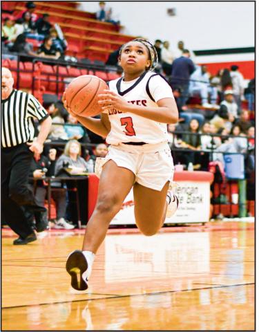 WILLIAMS ON THE GATHER - Levelland Loboette Whitney Williams gather her dribble to go up for a shot during their game at home against Lorenzo this past Tuesday night. Williams would have seven points in the win. (Staff photo by Jentezen Smith)