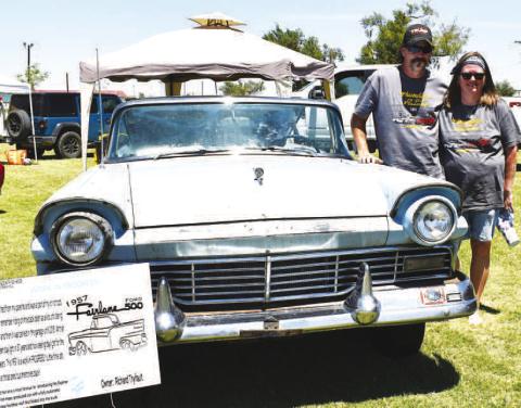 WORK IN PROGRESS – Pictured are Richard and Kim Thyfault with their 1957 Ford Fairlane Skyliner at the 20th annual Thunder on the Plains car show. The car won first place in the Project in Progress class and was featured on this year’s T-shirts, which were sponsored by the 509 Restaurant. (Staff photo by Ada Niederhauser)