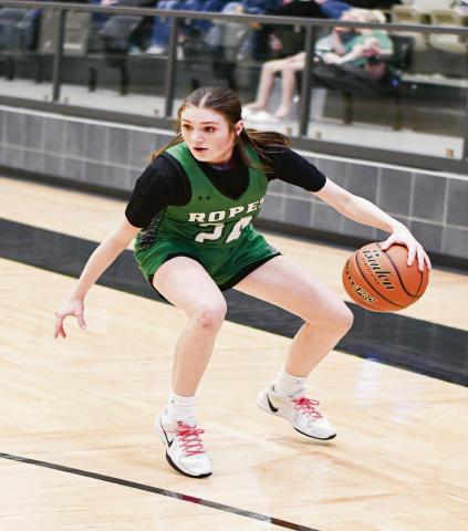 CROSS-OVER DRIBBLE - Ropes Lady Eagle Rylie Lester crosses over her dribble during their Area Round playoff game against Reagan County this past Thursday at Lamesa High School. (Staff photo by Jentezen Smith)