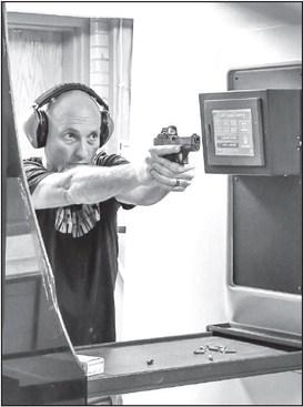 NEW SYSTEM - South Plains College Law Enforcement Instructor Mark Wittie demonstrated the new shooting range system on Monday. The new system is the culmination of two years of planning and work and is an integral part of the Law Enforcement Academy Curriculum. The range is also open to the public from 4-7 p.m. on Mondays while school is in session. (Staff photo by Jay Kelley)