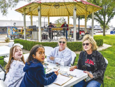 LAST FOOD TRUCK THURSDAY - Levelland Main Street held the last Food Truck Thursday for the year in downtown Levelland around the Hockley County Courthouse lawn. Pictured are Pam Alexander, Barbra Utley, Scout Scott and Courtney Castellano enjoying their time on the courthouse lawn. (Staff photo by Essence Childers)