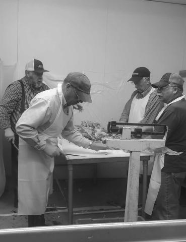 PREPARATIONS FOR SAUSAGE FEST- The St. Micheals Catholic Church in Levelland is having its Annual Sausage Fest on Saturday. In the photo Steven Henry, Kerry Siders, Al Castillo and Ken Miller are volunteering their time to prepare for the festival. (Staff photo by Emily Campos)
