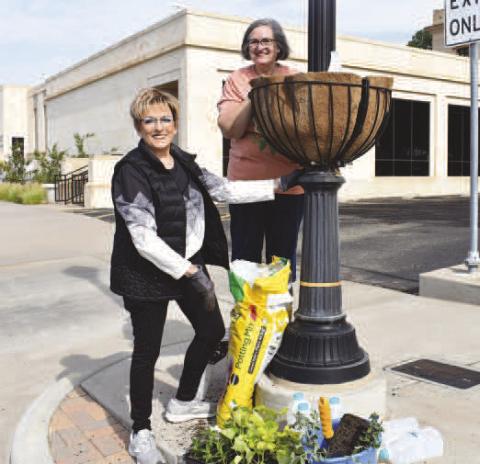 COMMUNITY PLANTING DAY - Community members patricipated in Saturday’s Community Planting Day which was hosted by the Levelland Main Street Program in downtown Levelland. Pictured is Mayor of Levelland Barbra Pinner and Connie Thomman enjoying their time planting their flowers.