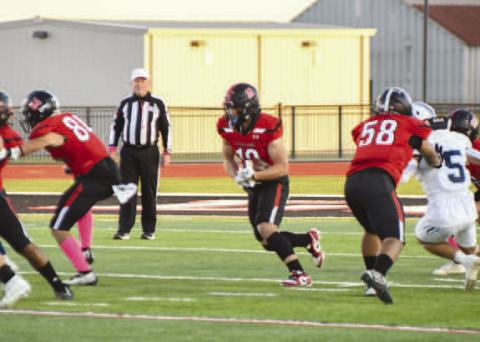 OPENING - Levelland athlete Rusty Johnson ran the ball during the teams loss to West Plains to pick up some much needed yards last Friday. (Staff photo by Dom Puente)