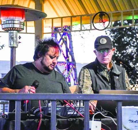 MUSIC ON THE LAWN – Juan Partida and Nick Williams sang and played music for Ladies Night Out attendees at the lit-up courthouse lawn gazebo Thursday night in downtown Levelland. (Staff photo by Evin Thomas)