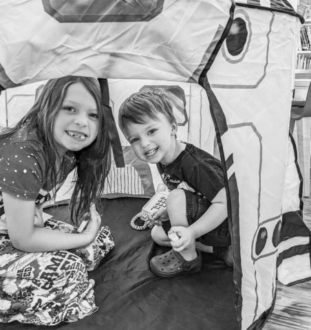 SPACE CAMP - The Sundown Library capped of their summer reading program for the month of June with a “Space Camp,” complete with a week’s worth of astronomical events, including themed book clubs and a movie matinee. A highlight was the shuttle added to the Tisdale’s Creative Play Children’s Area for the week. Pictured are Ayden and Alice. While June events were a wrap for the library, July programs are already going with a tribute to military personnel through arts collaboratives with Operation Gratitude a