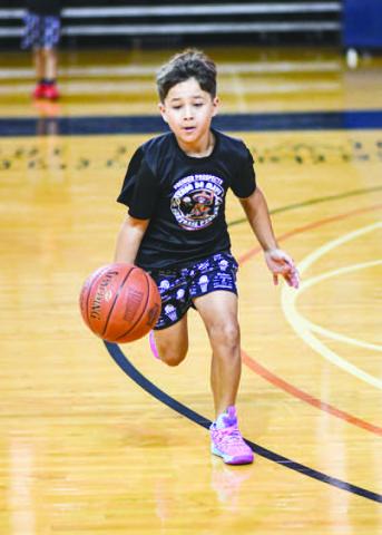FAST BREAK – Gregory Phillips practiced his fast break dribbling during the Levelland Lobo Basketball Camp at the Texan Dome on August 5. (Staff photo by Jentezen Smith)
