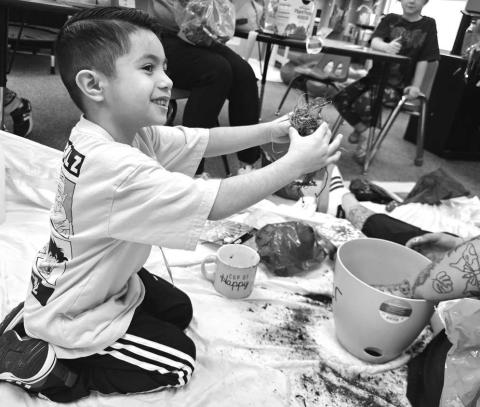 LISD CELEBRATED AG WEEK - The Texas Farm Bureau sent reading teachers their book of the year: How To Grow A Monster by Kiki. Pictured is Xavier Mata planting his spring flower after listening to the Ag Awareness book. (Photo courtesy of Cristal Isaacks)
