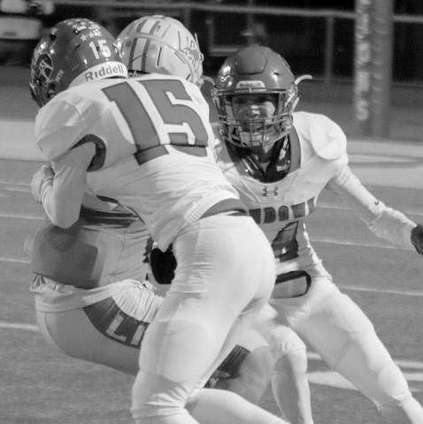 ROUGHTACKLE- Sundown Roughnecks Branson Sanders(15) and Koy Torrres (4) tackled a ball carrier during a road loss to New Deal last Friday. The Roughnecks will play host to the Tahoka Bulldogs on Friday. (Photo Courtesy of Chris Bratcher)
