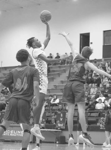 SKY HOOK - Levelland Lobo Eryk Jones shot a sky hook over the Sundown defense during the team’s last non-district game of the season at home. (Staff photo by Aalijah Soliz)