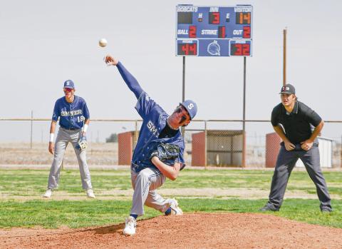 MOUND DELIVERY - Smyer Bobcat Skyler Pond delivers a pitcher from the mound as his teammate Colton Burriss and the umpire lock in behind him during their game against Ropes this past Saturday at Smyer High School. (Staff photo by Jentezen Smith)