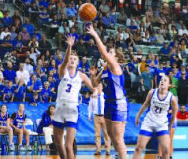 SKY HOOK - Lady Lope Morgan Waggoner shot the ball over the defense this past Friday for their basketball playoffs. (Staff photo)