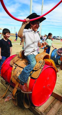 ABCTEXASPUBLICSCHOOLWEEK- Celebrating all things Texas at ABC students dressed like a Texan and enjoyed a hoedown, picnic lunches, planting, horse races, roping, and a Texas story. Pictured is Kindergartener William Frias trying out his roping skills. Frias parents’ are Yesenia and Juan Frias. (Photo courtesy of Cristal Isaacks)