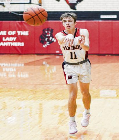 THINK FAST! - Whitharral Panther Ayden Dockery passes the basketball to a teammate during their game against Southcrest this past Thursday at home. (Staff photo by Jentezen Smith)