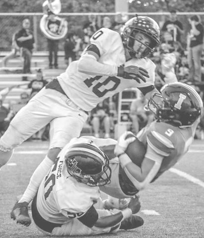 HIT STICK - Levelland Lobos Devin Ponce held the Idalou ballcarrier in place while Gage French layed him out for the forced fumble last Friday night. (Staff photo by Aalijah Soliz)