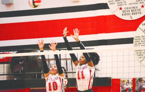 BLOCK PARTY - Levelland Loboettes Tanaesia Brackens and Mia Morin went up to block the shot last Tuesday in their dominant win against Sweetwater. (Staff photo by Aalijah Soliz)