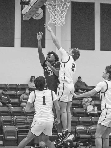 TOUGH SHOT - Morton Indian Tra Holland layed the ball up through contact during the team’s game against Klondike on the road. (Staff photo by Aalijah Soliz)