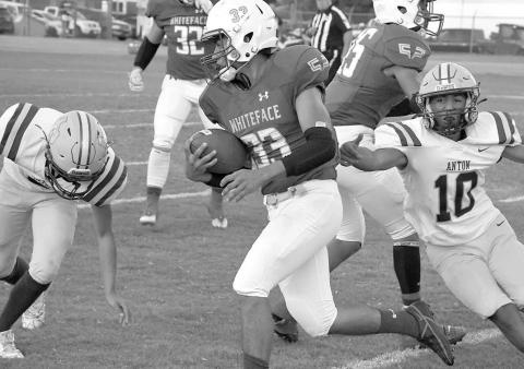 SPLITTINGDEFENDERS- Whiteface’s Julio Borunda had four carries for 35 yards in a 53-6 homecoming win over the Anton Bulldogs last Friday in UIL high school six-man football action. Borunda and company will travel to Wildorado on Friday for a 7:30 p.m. game. Anton hosts Spur, also at 7:30 p.m. (Photo Courtesy of Jay Kelley)